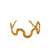 Gold wave shape cuff bracelet made of flexible stainless steel with waterproof 18K plating and bead clasp, elegant modern jewelry for everyday wear